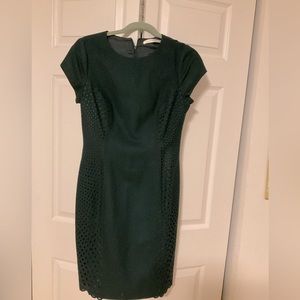 Forest green lightwool dress with preforated panels